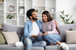 © Prostock-studio - Happy young indian couple spending time together at home