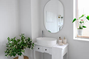 Poster - Sink bowl and bath accessories on dressing table in interior of light bathroom