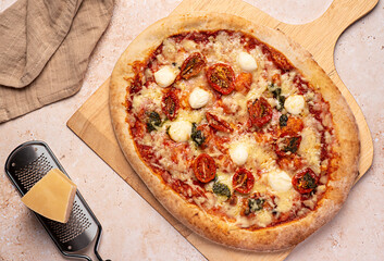 Wall Mural - Food photography of pizza; mozzarella, dried, tomato, basil, pesto,; parmesan; cheese; tomato; sauce; oregano; spicy; background; meal; food