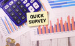 © Uladzislau - Business concept. Paper with text QUICK SURVEY on a blue table.