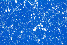 Background:  White Paint Random Pattern On Solid Blue Flat Surface