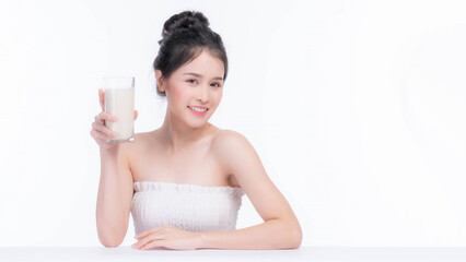 Wall Mural - beauty woman Asian cute girl feel happy drinking milk for good health in the morning on white background - lifestyle beauty woman concept