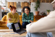 © ReeldealHD images - Young adults studying together in a shared loft apartment