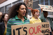 © ReeldealHD images - Young adult female shouting at a climate change protest
