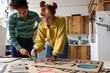 © ReeldealHD images - Young adults making demonstration banners for a climate change protest