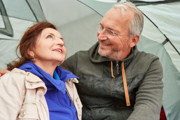 Wall Mural - Couple spending leisure time together in camping tent