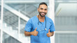 © Daniel Ernst - Motivated mexican male nurse or doctor with beard and stethoscope showing thumbs up
