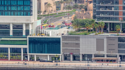 Wall Mural - Walking promenade along water canal in Business Bay district of Dubai aerial timelapse.