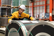 © Nassorn - Female industrial engineer in white helmet and safety jacket work in heavy metal engineering factory. Latin inspector woman inspecting production material in metalwork manufacturing facility, portrait