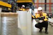 © Nassorn - Latino industrial engineer wears safety helmet work in heavy metal engineering factory. Hispanic worker in white hard hat checking product materials equipment in metalwork manufacturing facility