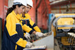 © Nassorn - Industrial engineer and Latino woman colleague in safety helmets examining production in heavy metal engineering factory. Hispanic inspector inspecting metalwork in manufacturing warehouse facility.