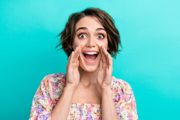 Portrait of astonished positive person arms near open mouth scream communicate isolated on cyan color background