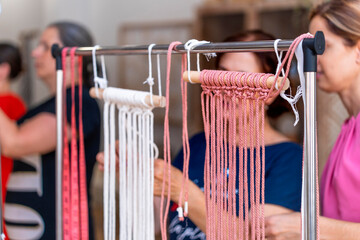 Wall Mural - Macrame Workshop. Textile Crafters: Women Creating Macrame Treasures in Workshop