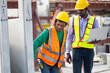 © NVB Stocker - Asian indian construction architect Engineering man and senior worker in safety hardhat working on laptop computer at Prefabricated concrete factory Heavy industrial