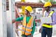 © NVB Stocker - Professional engineering teamwork. Asian indian construction architect Engineering man and senior worker in safety hardhat working on laptop computer at Prefabricated concrete factory Heavy industrial