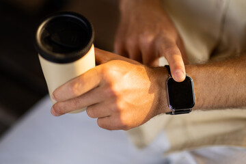 Fototapete - Close up shot of businessman hand uses smart watch