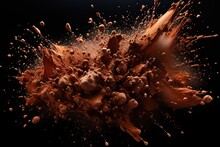Cocoa Powder Explosion On Black Background.