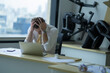 © Wanwajee - Business man put hands over head with stress, depressed emotion while working and looking at laptop, failure, unsuccess, unhappy emotional about work.