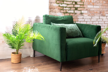 Wall Mural - Elegant living room interior in loft style with green armchair near brick wall in room. Interior mid century style at home.	
