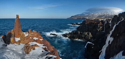 Wall Mural - Russia. Far East, Kuril Islands. Very hard and sharp basalt rocks along the coast of the Sea of Okhotsk on the island of Iturup.