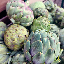 Artichoke, Variety Of A Species Of Thistle Cultivated As Food. Background From Artichokes.
