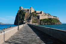 Aragonese Castle Seen From The Bridge To Ischia Island, At The Northern End Of The Gulf Of Naples, Italy.