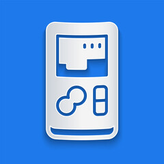 Poster - Paper cut Portable video game console icon isolated on blue background. Handheld console gaming. Paper art style. Vector