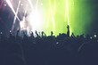 © erika8213 - Abstract photo of crowd at concert and blurred stage lights.