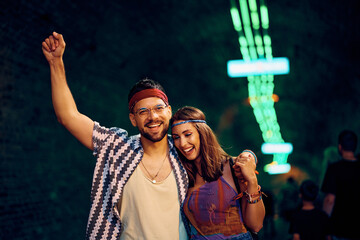 Wall Mural - Happy embraced couple after open air music concert.