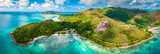 Praslin Seychelles tropical island with withe beaches and palm trees. Aerial view of tropical paradise bay with granite stones and turquoise crystal clear waters of Indian Ocean