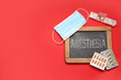 © Pixel-Shot - Chalkboard with word ANESTHESIA, pills and medical mask on red background