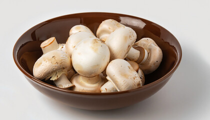 Wall Mural - Fresh white mushrooms champignon in brown bowl on white background.