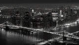 Fototapeta  - Black and white cityscape illuminated by street lights at dusk generated by AI