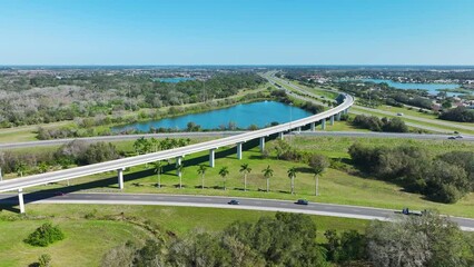 Poster - View from above of busy american highway bridge with fast moving traffic in green Florida area. Interstate transportation concept