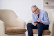 © Elnur - Old male psychologist sitting in the room