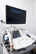 Modern medical equipment. An ultrasound machine scanners and sensors in hospital clinic room