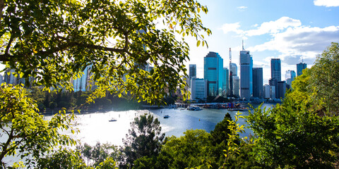 panorama of brisbane cbd seen from kangaroo point on sunset; skyscrapers and famous story bridge in downtown of brisbane city in queensland, australia	