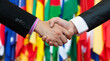 © xy - Businessmen shaking hands in front of the multi - national flags