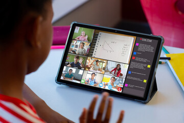 Poster - African american boy attending online class over digital tablet with students on screen at home