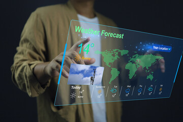 Wall Mural - man in casual dress pointing hand to check the weather forecast on screen checking the weather during the day, such as temperature, wet dry bulb absulute humidity, relative, atmospheric pressure