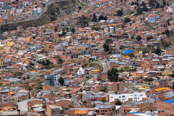 View from the scenic road to the landmark Muela del Diablo over the highest administrative capital, the city La Paz and El Alto in Bolivia - close up of hundreds of houses