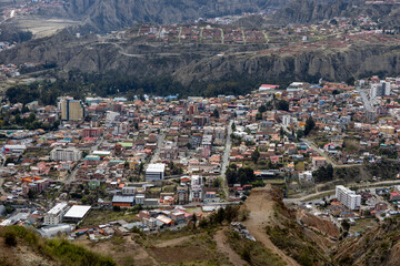 View from the scenic road to the landmark Muela del Diablo over the highest administrative capital, the city La Paz and El Alto in Bolivia - close up of hundreds of houses of La Paz