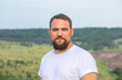 © Andrey_Arkusha - Portrait of a middle-aged brunette man with a thick beard