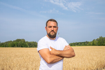 Portrait of a middle-aged brunette man with a thick beard