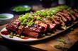 Char Siu, with slices of juicy barbecued pork on a white rectangular plate and garnished with green onions