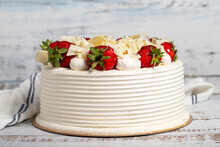 Strawberry And White Chocolate Cake. Fruit And Cream Cake On Wood Background. Close Up