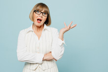 Blonde Shocked Questioned Sad Employee Business Woman 50s Wear White Classic Suit Glasses Formal Clothes Look Camera Spread Hand Isolated On Plain Pastel Blue Background. Achievement Career Concept.