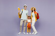 Traveler parents mom dad with child girl wear casual clothes hold passport ticket bag isolated on plain purple background. Tourist travel abroad in free time getaway. Air flight trip journey concept.