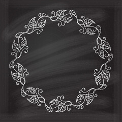 Wall Mural - floral decoratare frame on a chalkboard background. ivy leaves vintage style wreath