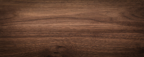 Walnut wood texture background. Wide format black walnut natural texture desktop background.	